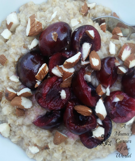 Bowl of Oatmeal with sliced cherries and slivered almond pieces