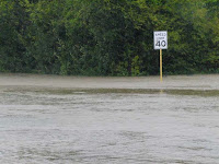 A road floods in Houston, Texas after rains from Hurricane Ike in 2008. (Credit: karllehenbauer/flickr) Click to Enlarge.