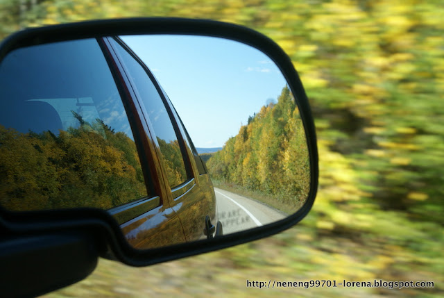 view of the road from passenger mirror