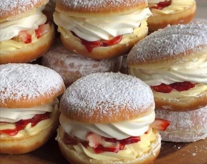 Donut stuffed with whipped cream and strawberry