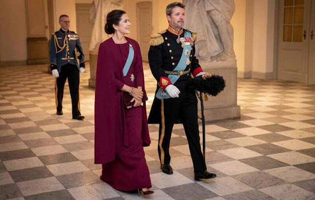 Princess Mary in bordeaux gown by Lasse Spangenberg. Queen Margrethe wore a bordeaux dress by Craftsmen's Association