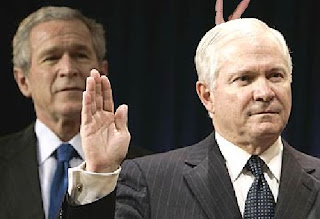 President Bush giving Defense Secretary Robert Gates the old rabbit ears at swearing-in ceremony