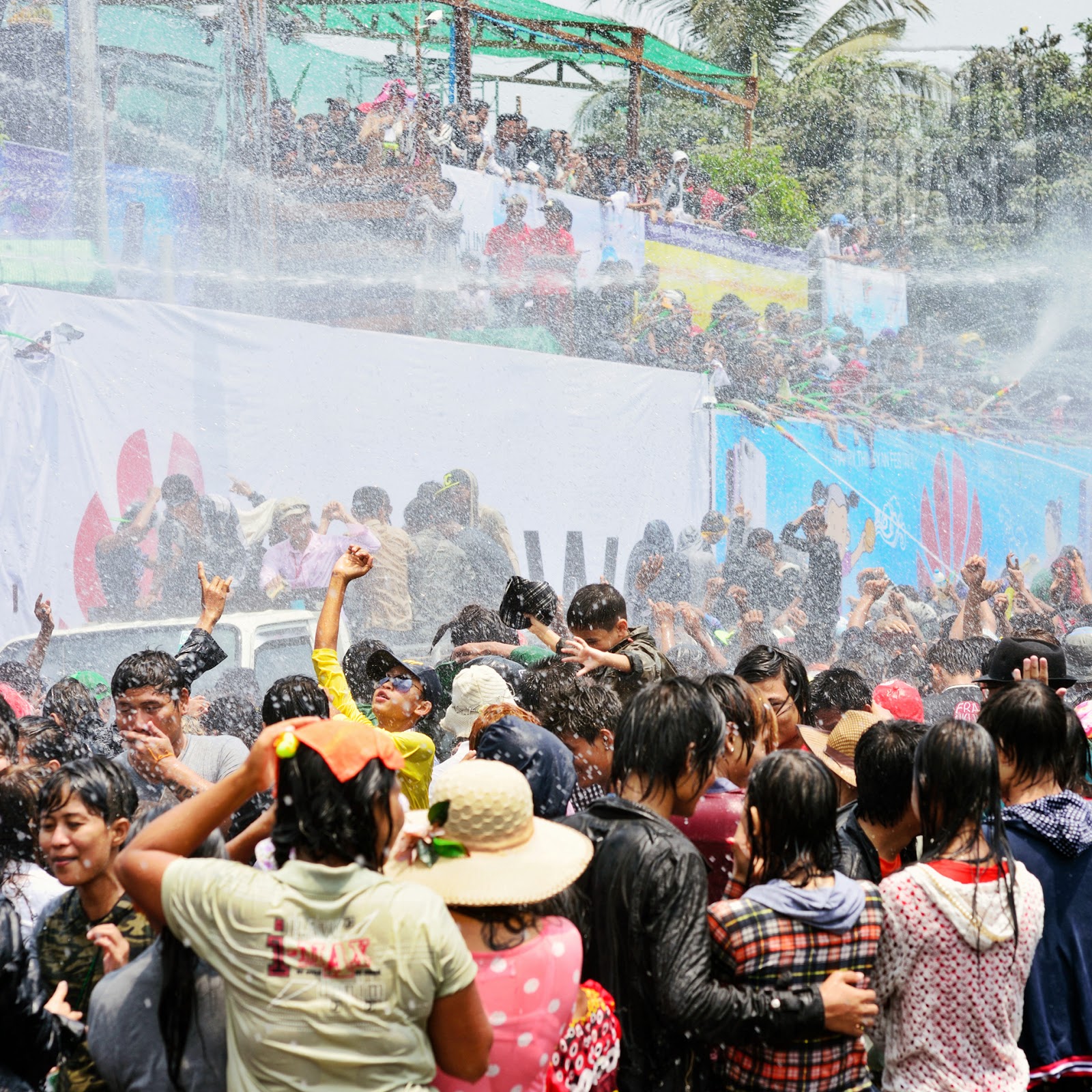 A crowd of people getting wet near Inya Lake, Yangon, during Myanmar's water festival.