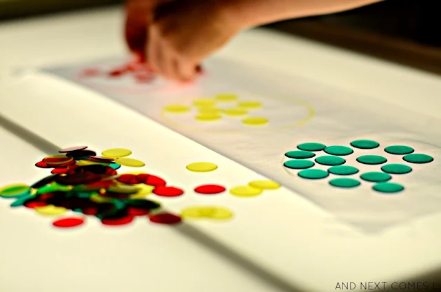 Color matching light table activity for kids inspired by traffic lights from And Next Comes L