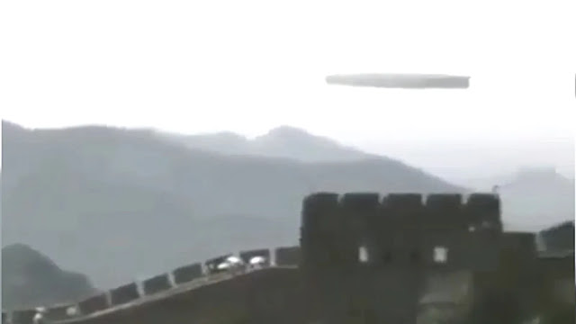 Unbelievable UFO sighting slowly flying past the Great Wall Of China.