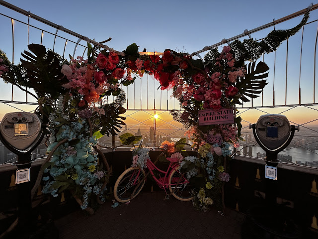 bike and flower display at top of empire state building