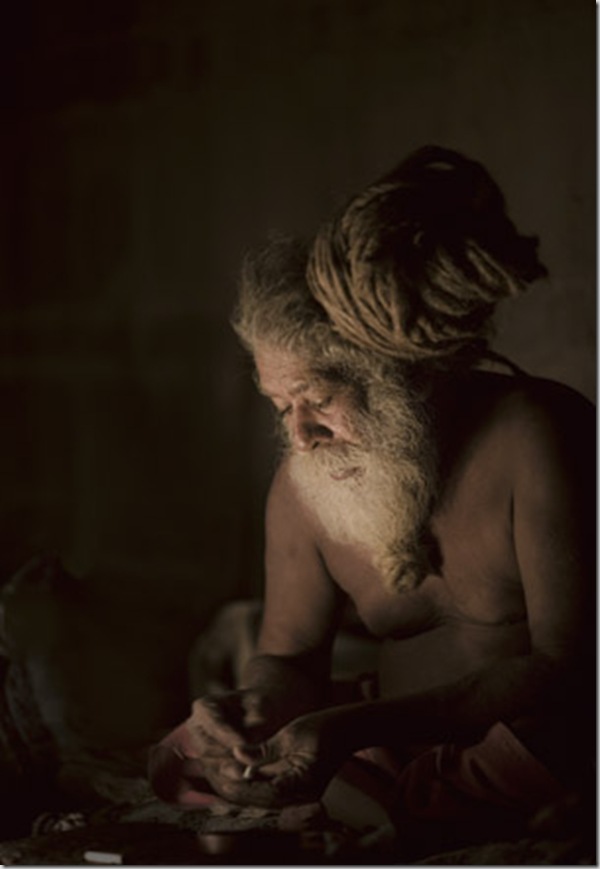  Naga sadhus preparing a charas. Ard Kumb Mela in Allahabad 2007