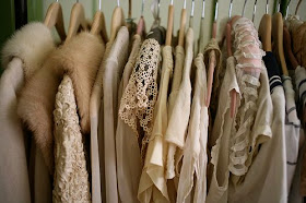 Hanging Rack of Clothing: Dresses and Furs