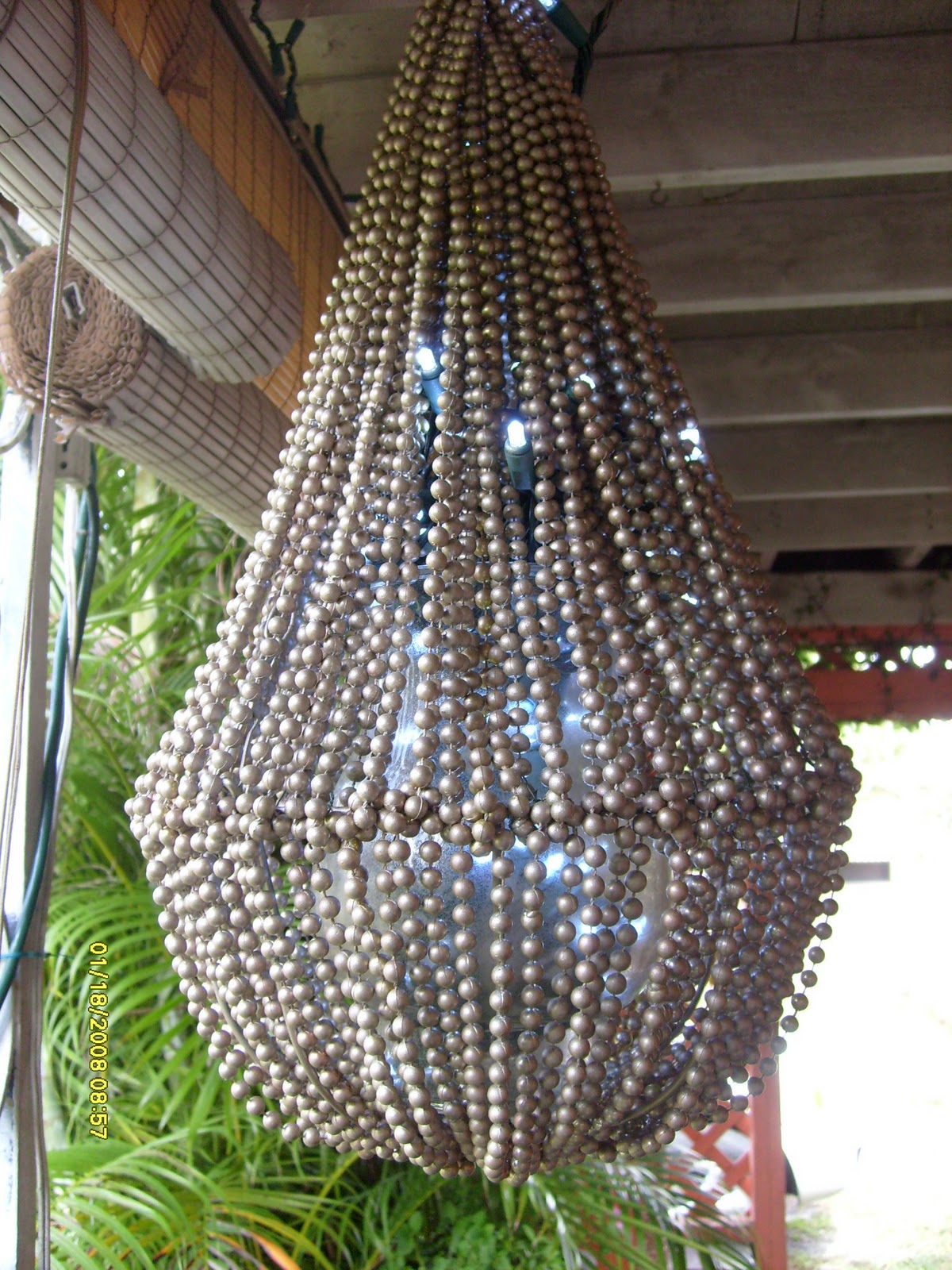 The beaded chandelier in the daylight. You can barely make out the  title=