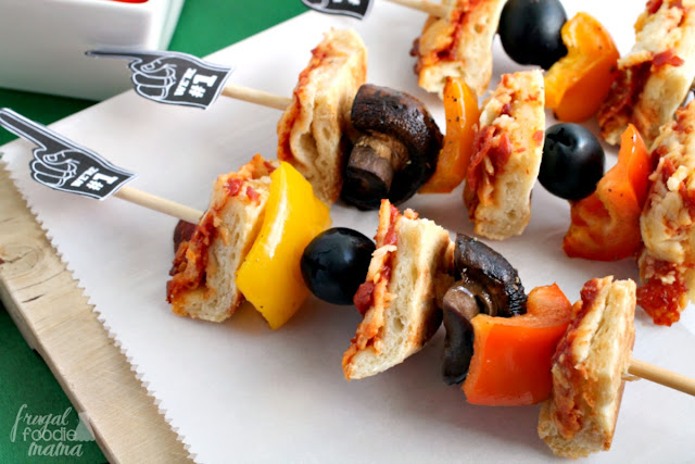 Bite-sized pieces of crispy cheese & pepperoni pizza are skewered with your favorite pizza toppings in these Easy Pizza Kabobs... perfect for game day entertaining!