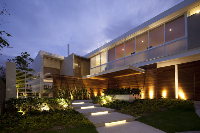 Modern facade with lights at sunset 