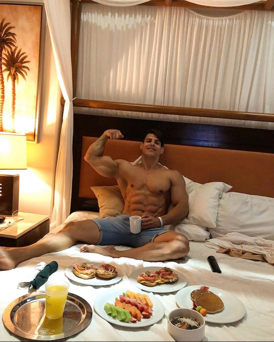 sexy-guy-eating-food-max-murillo-shirtless-body-biceps-flex-bed