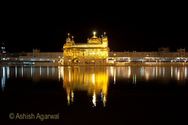 Photo of The Golden Temple at night, located in the middle of the Holy Sarovar in Amritsar