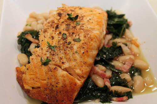 Broiled salmon with white bean, kale and bacon ragout