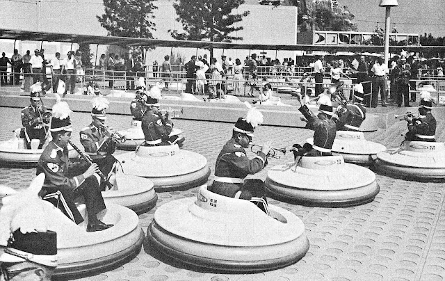 1961 Disneyland musicians in uniforms and bumper cars play while everyone ignores them, loss of dignity