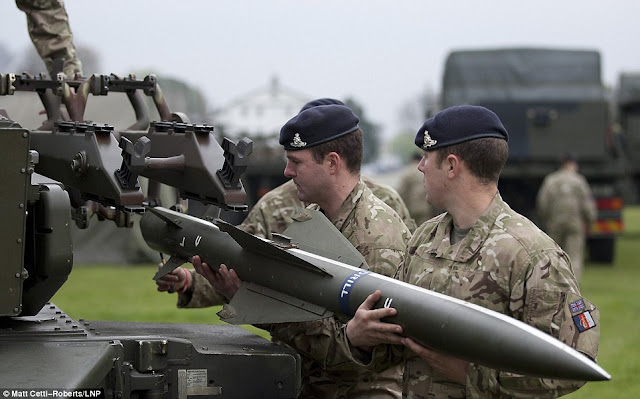 Gunners from Sphinx Battery, 16 Regiment Royal Artillery, fit a practice missile to a Rapier anti-aircraft system stationed at Blackheath  Read more: http://www.dailymail.co.uk/news/article-2138488/Typhoon-fighter-planes-stationed-RAF-Northolt-Olympics-military-build-up.html#ixzz1u8zLHLHh