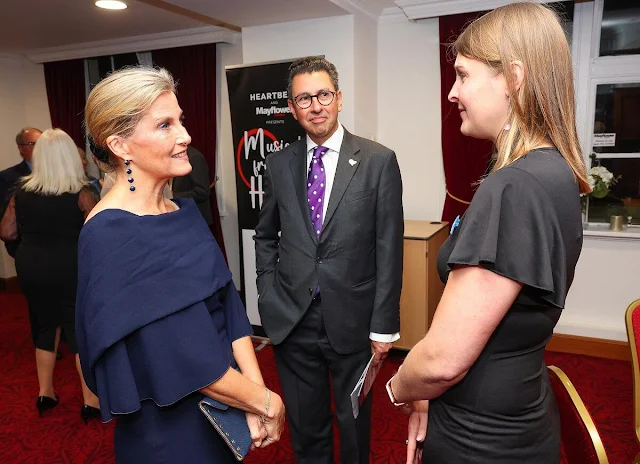 The Duchess of Edinburgh wore a navy Sunyani midi dress by Roksanda. Performer Earl Carpenter