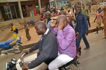 Wow! See Gov. Fayose Riding on Okada As He Inspects Newly-installed Water Taps in Ekiti Community (Photos)