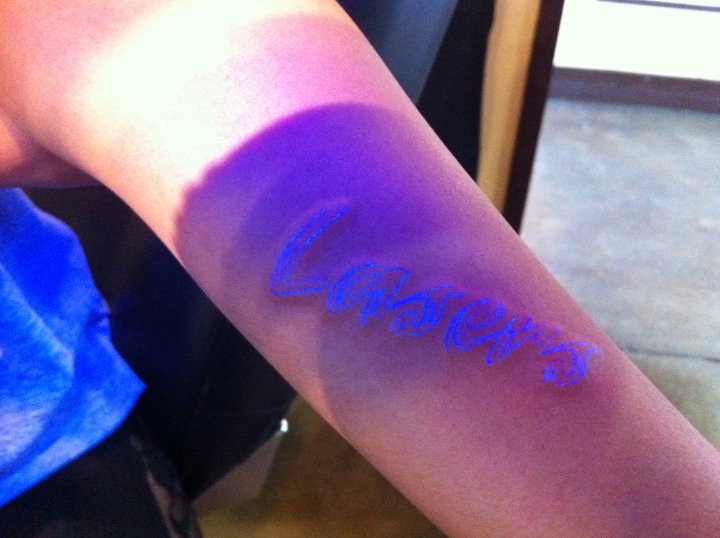 So she got a Lasers UV tattoo that only shines under blacklight