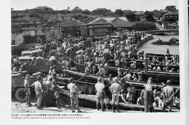 Former Japanese Imperial soldiers discarding war materials, Miyako Island