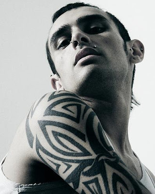 Arm Tribal Tattoo Nice tribal tattoo on young male's upper arm