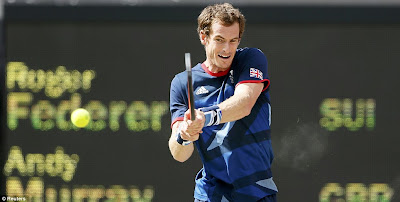  Net gains: Murray looks to he heavens after beating Federer 6-2, 61, 6-4 on Sunday afternoon