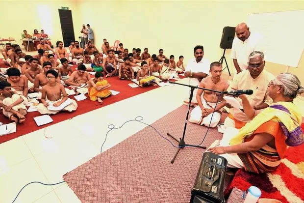 Trainee priests of various ages attending the Basic Priest Level One Course, instructed by Muthukumara (right). With them is Nanda Kumar (second right).