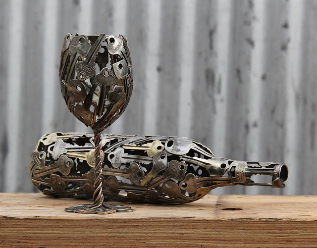 Recycled art made from old key and coin