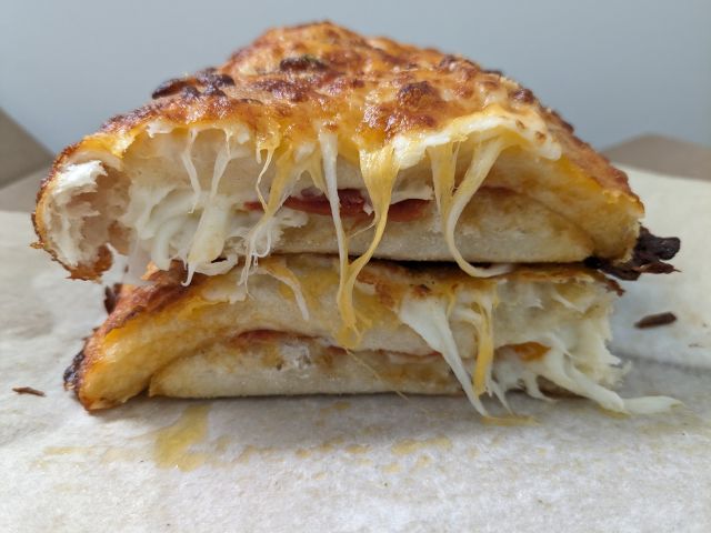 Domino's Pepperoni Stuffed Cheesy Bread cross-section.