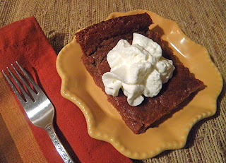 Slice of Persimmon Pudding with Whipped Cream