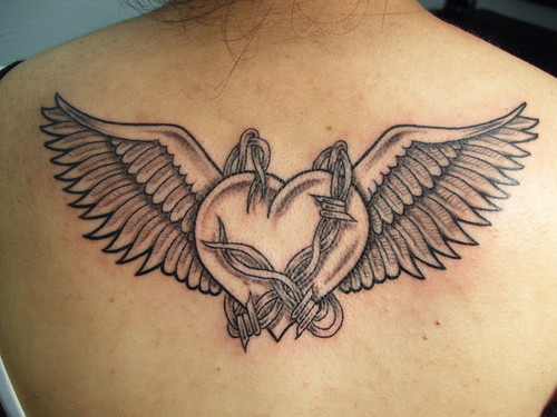Custom Hearth With Wings And Barbwire Tattoo