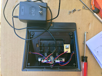 Modified light -- battery and solar panel removed, wall charger wired to the battery port