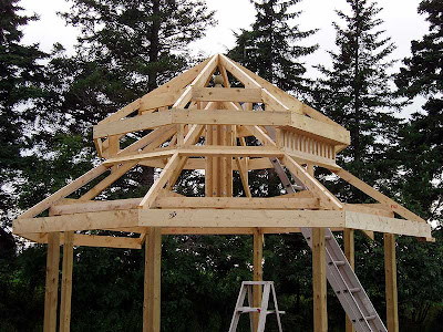 The upper eaves and some of the vent spindles have been added.