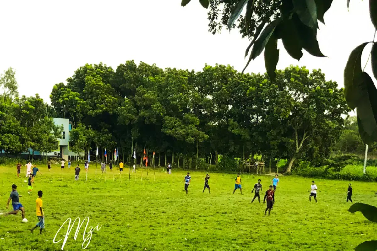 Youths are playing on the village playing field