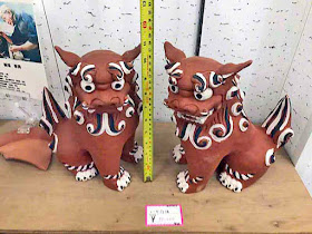 Black, white and red clay Shisa, pair