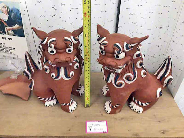 Black, white and red clay Shisa, pair