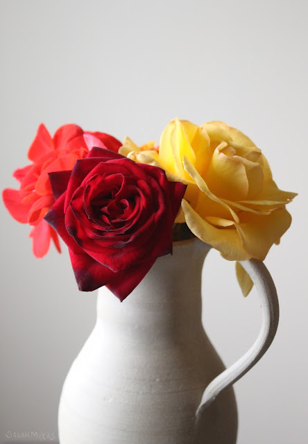 flowers, flower, photography, roses, rose, bloom, sarah, myers, yellow, red, geranium, bouquet, bunch, ceramic, amy, myers, pitcher, tea rose, bright, brilliant, colourful, interior, decor, decoration, photograph, beauty, brilliance, dim, day