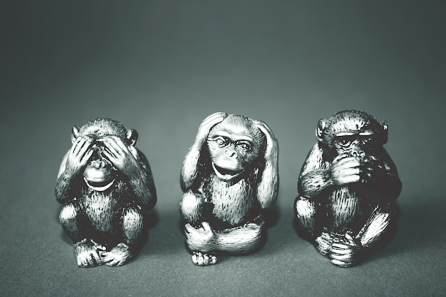 Three monkey figurines, see no evil hear no evil speak no evil