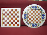 Square and round shape chess board in white marble