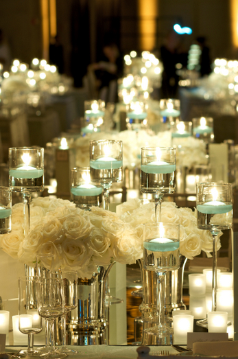 wedding centerpieces with candles and poinsettias