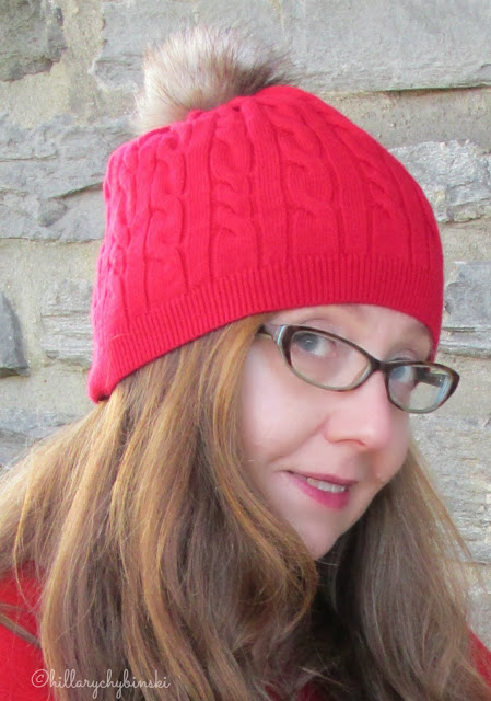 Red Knit Hat with a Fur Pom-Pom