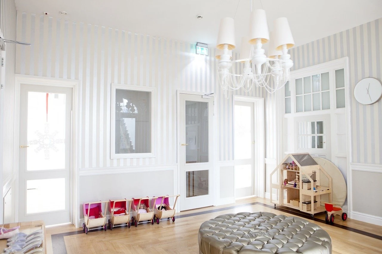 A stylish looking playroom in a white and grey house