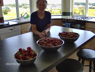 Beate in Kitchen with berries from her garden