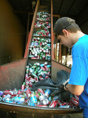 A sanitation worker operating a recycling facility