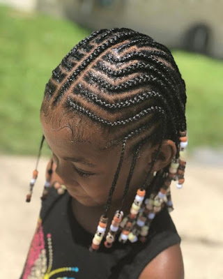  Here we have a stunning short tribal braid idea that has been finished off with beads 32 African Long Tribal Braids Ponytail Updos To Try In 2019