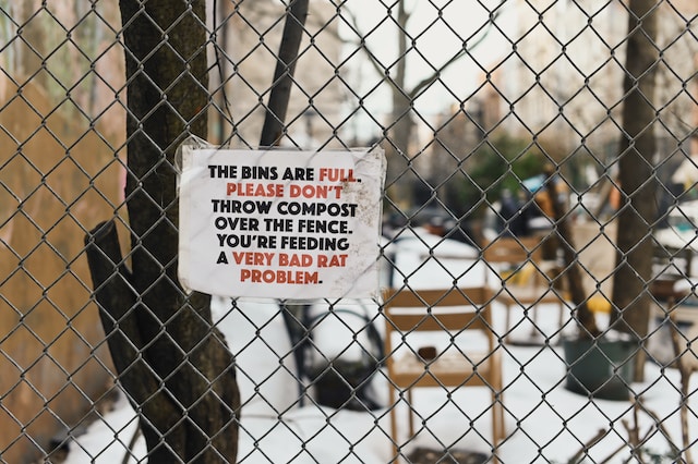 A 'very big rat problem' sign in New York City photo by Robinson Greig on Unsplash - https://unsplash.com/photos/white-and-black-quote-on-brown-wooden-fence-BL6i5uYZuVQ