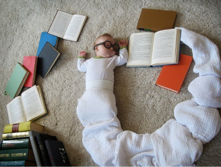 Just like this baby... sleep with book.. it's nice actually =)