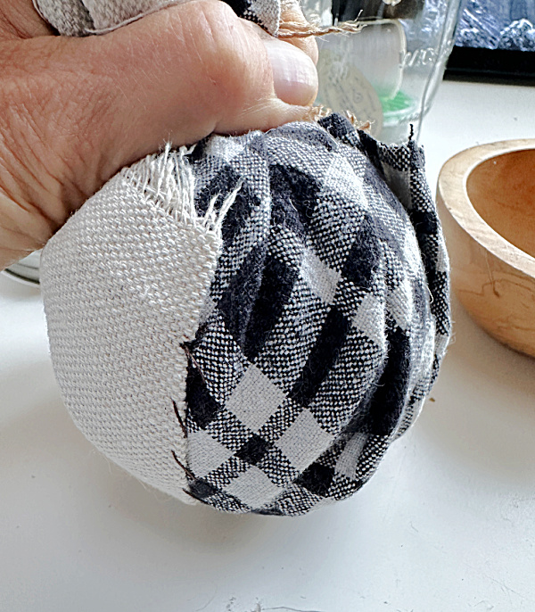 hand gathered fabric around dryer ball