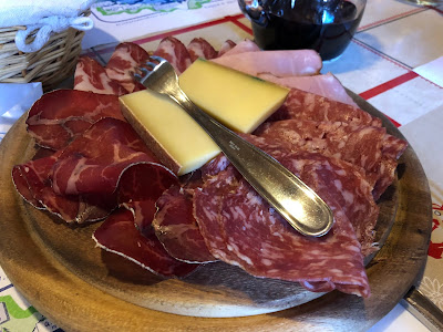 Lunch at Rifugio Bertone. Meat and cheese plate with fontina and mocetta. 