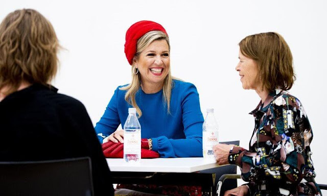 Queen Maxima wore a colourful midi skirt from Claes Iversen Haute Couture Spring Summer 2017 collection. Blue silk blouse